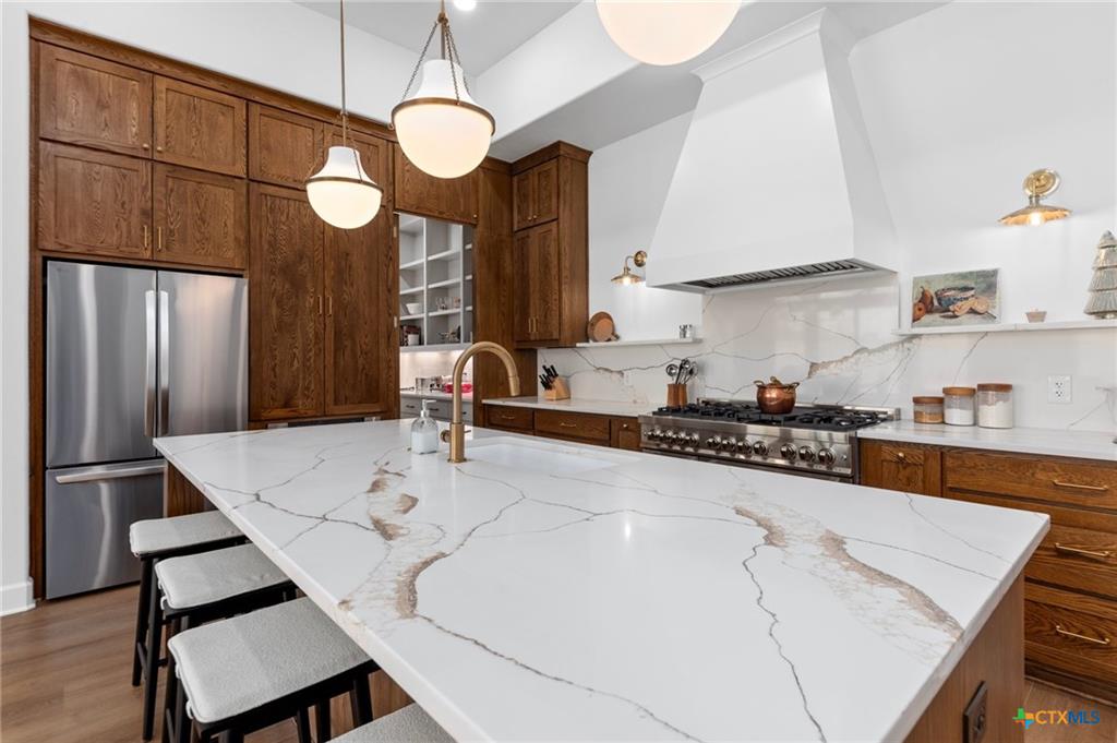 Upgraded builder model-home kitchen in Temple TX — the design-center finishes that aren't in the base price