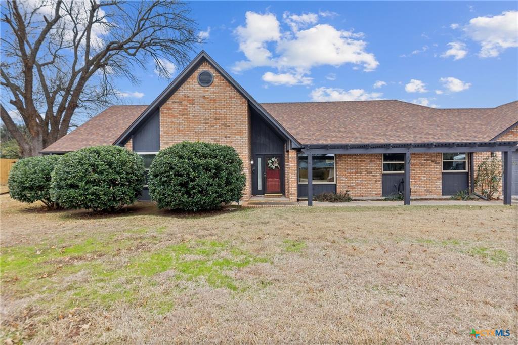 Western Hills brick ranch with mature trees