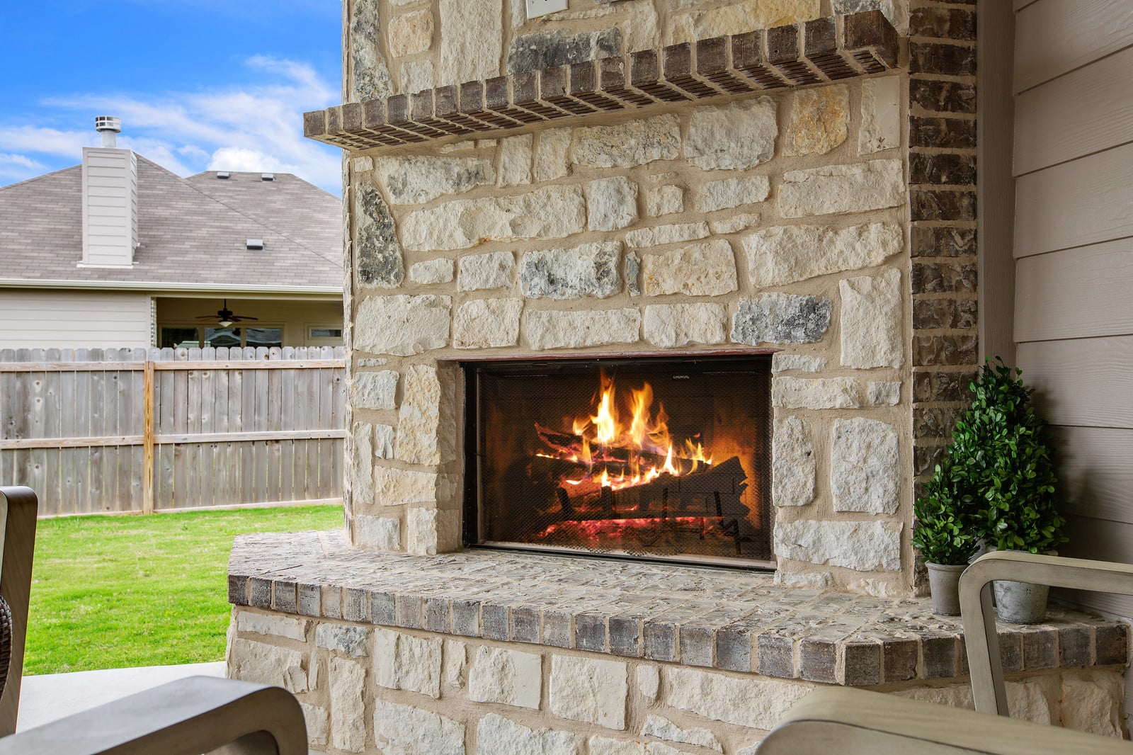 Kiella living area with fireplace and open concept layout