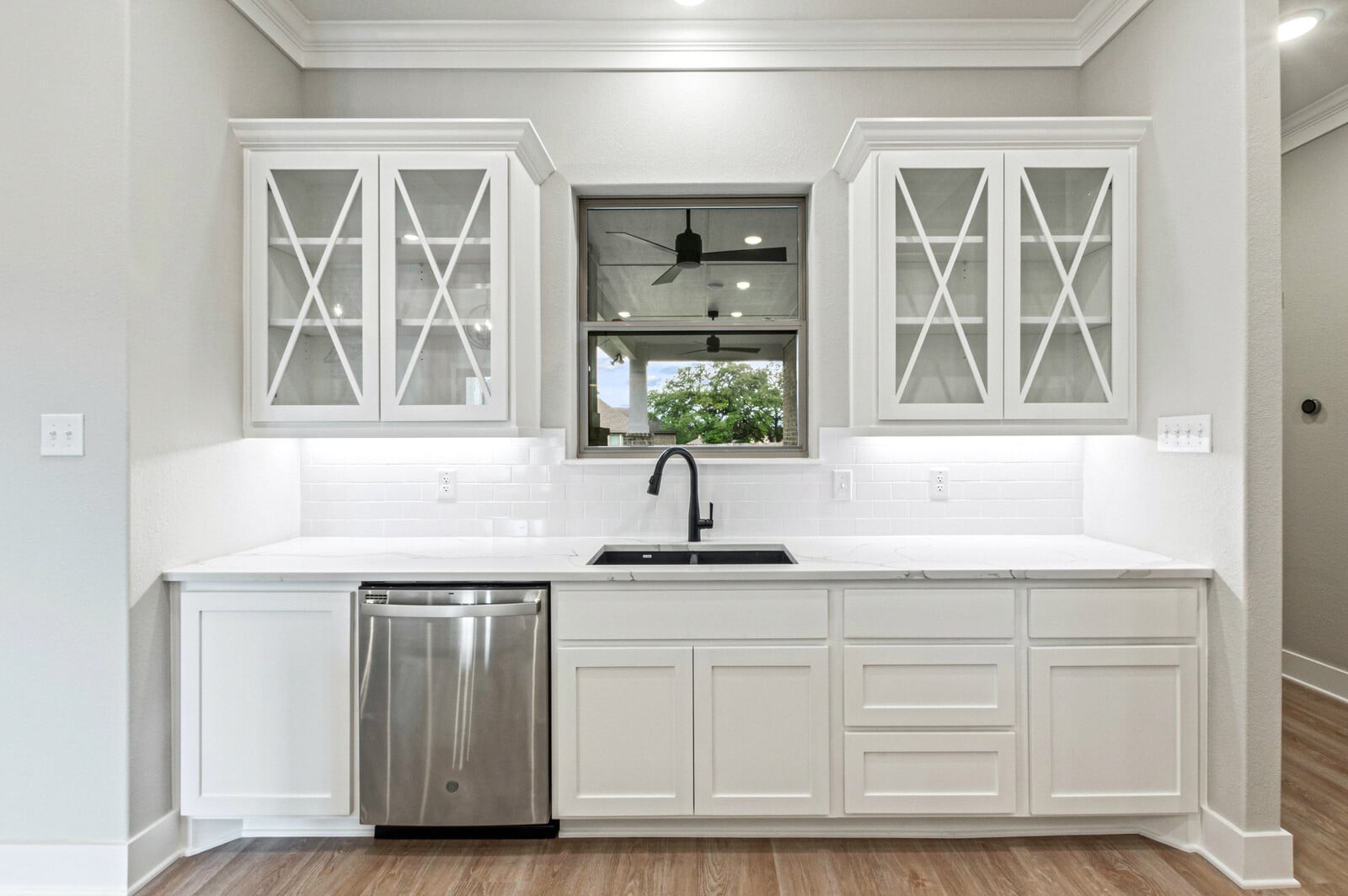 Kiella kitchen with granite countertops and stainless steel appliances