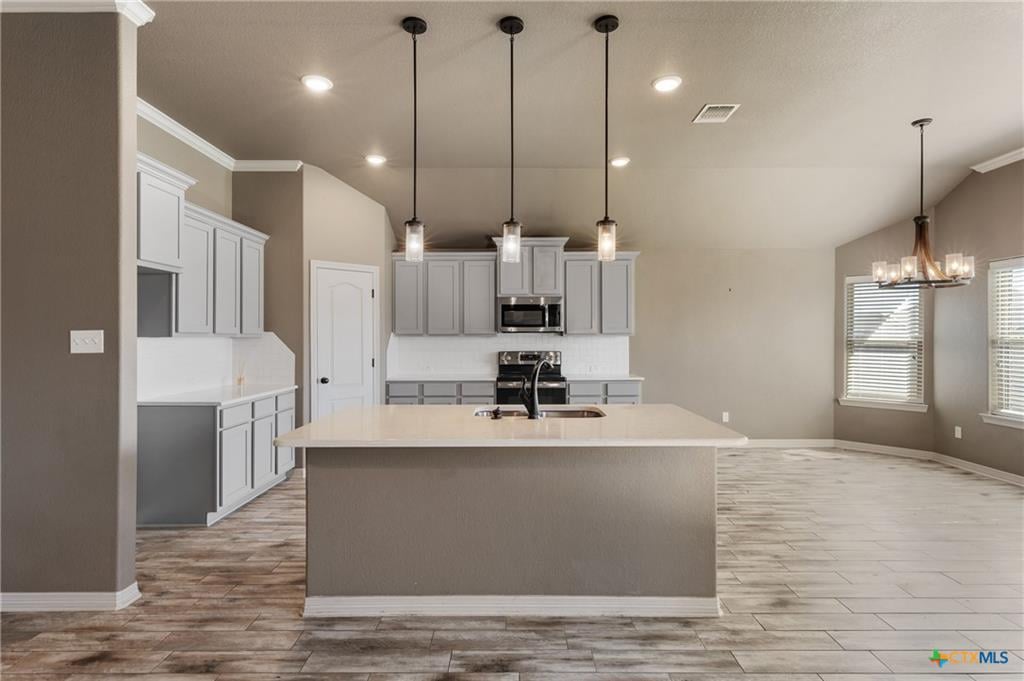 Updated kitchen with island in Carriage House Trails