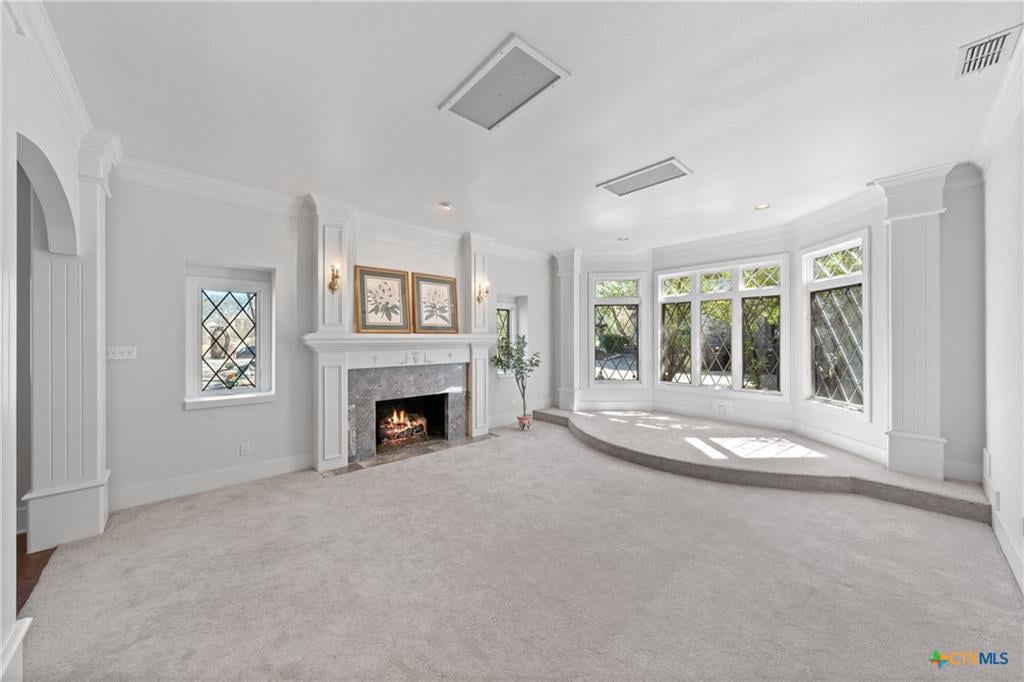 Natural light flooding through large windows in a Cliffs of Canyon Creek living room