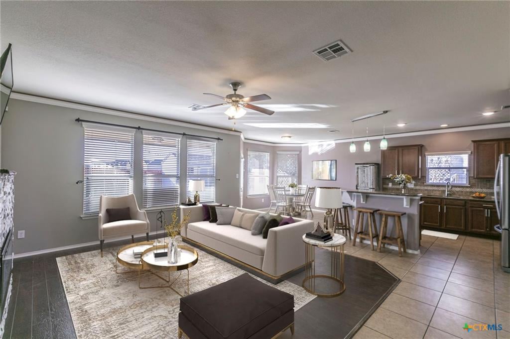 Open-concept living and dining area inside a Windmill Farms home, Temple TX