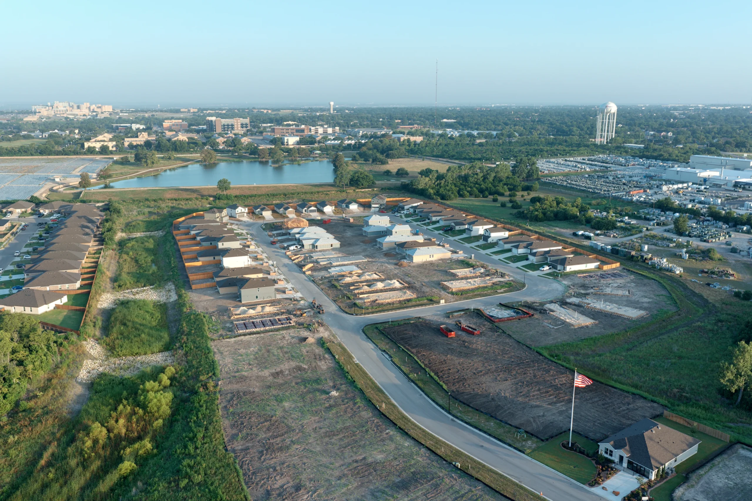 Overhead aerial view of the pond and surrounding Pecan Creek homes