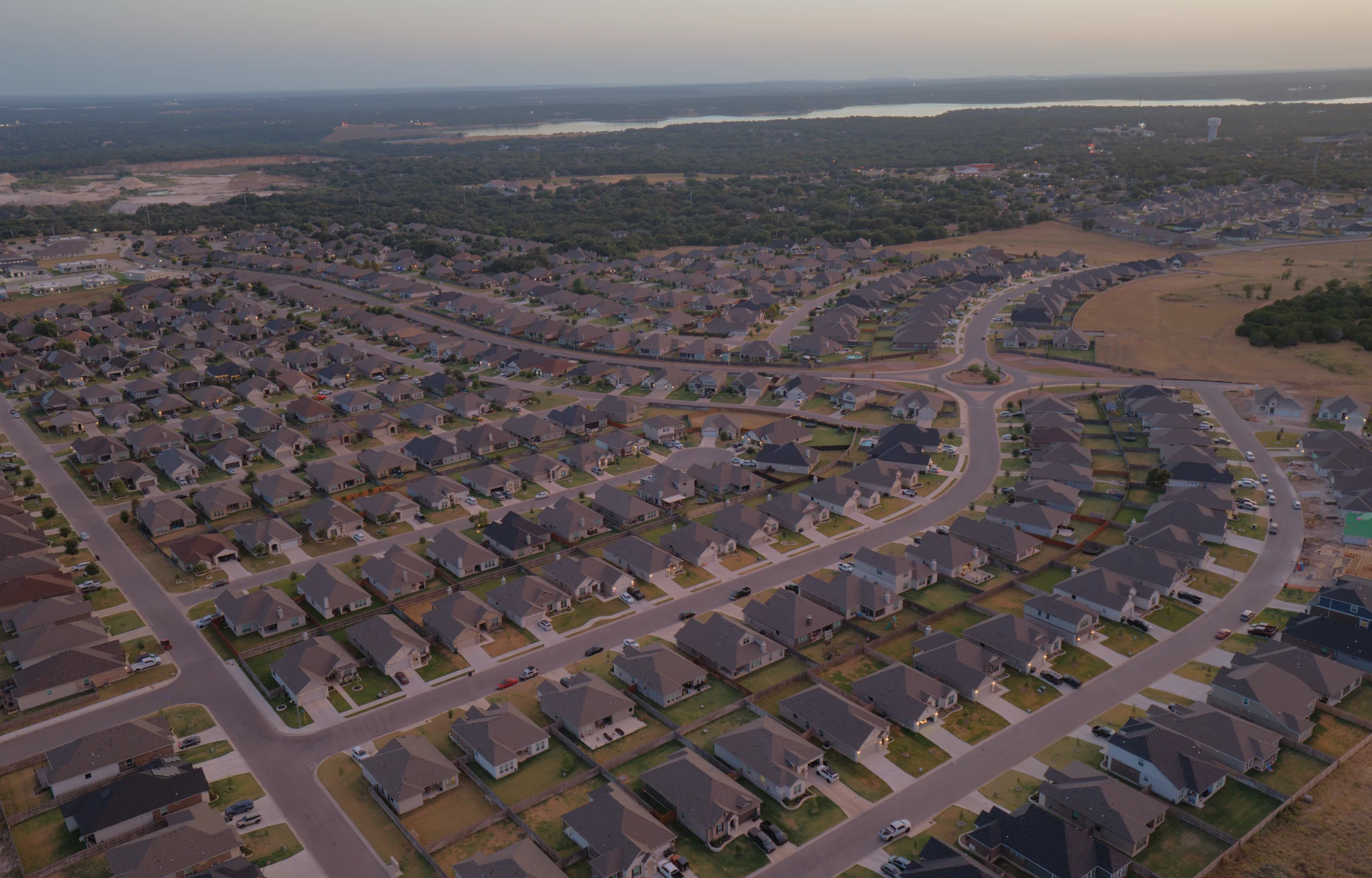 Aerial view of homes, streets, and surrounding West Temple context near The Groves at Lakewood Ranch