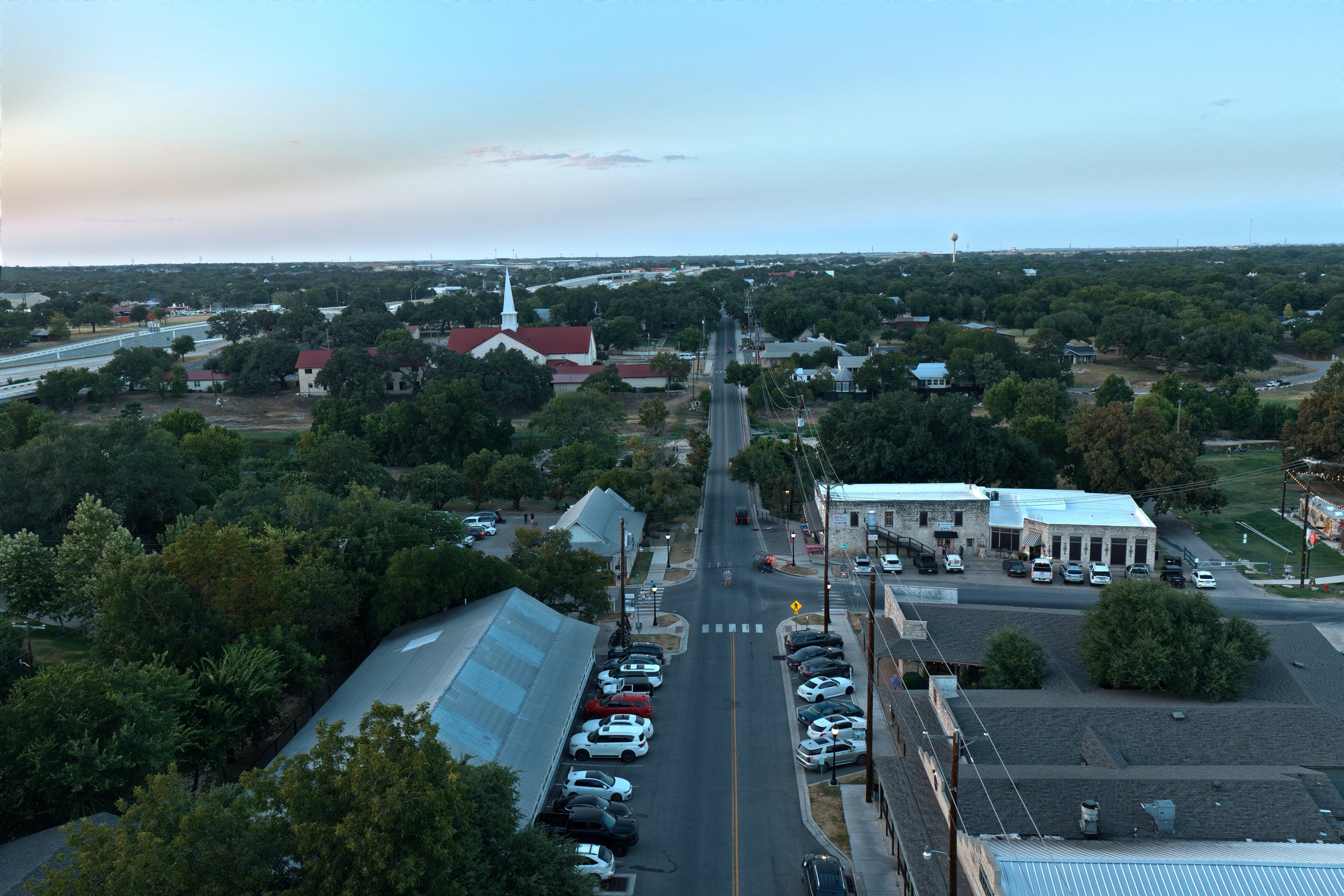 Main Street Salado TX at dusk, aerial looking north