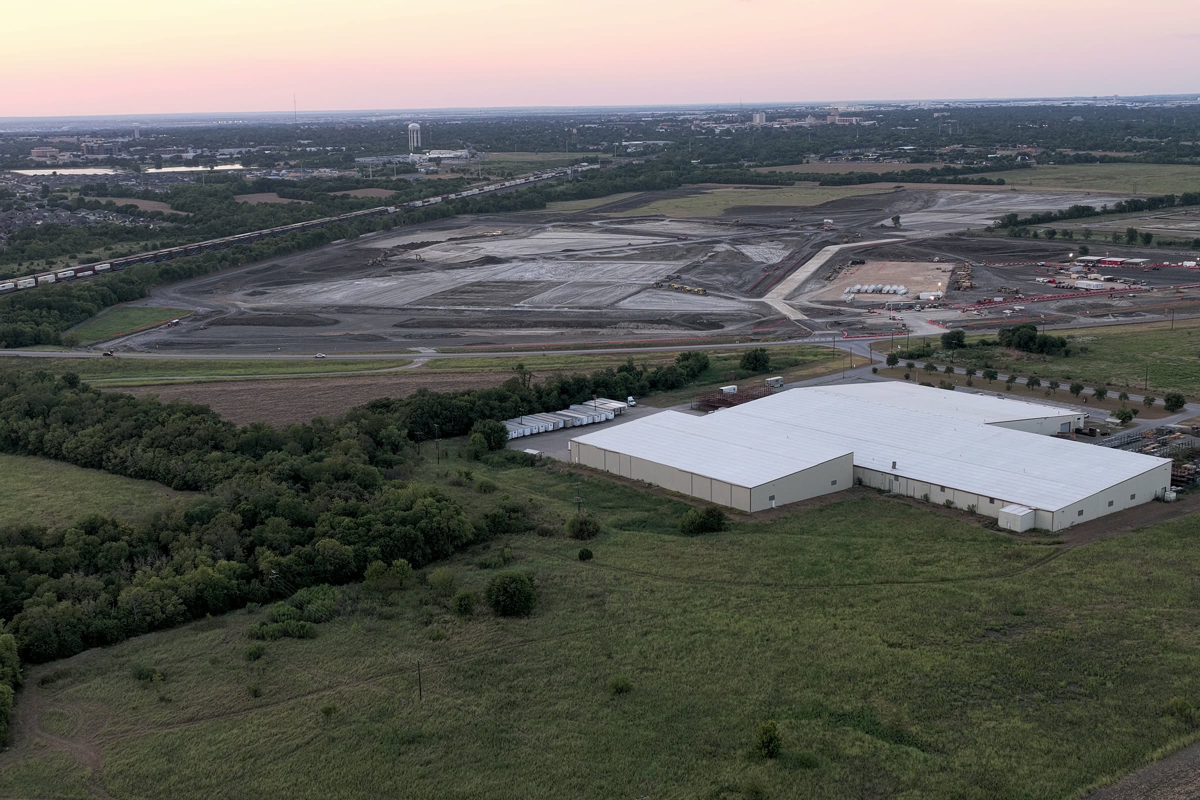 Several hundred acres under grading in southeast Temple, TX, rail-served, with the Temple skyline on the horizon