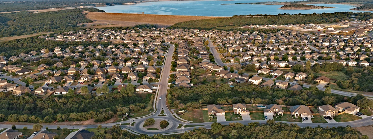 Aerial overview of homes and streets in Three Creeks, Belton TX