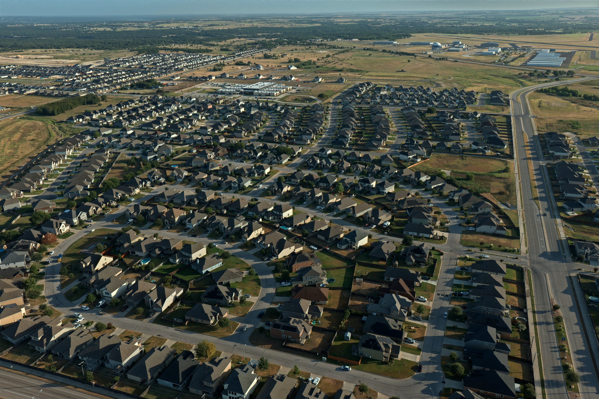 Aerial of Westfield rooftops at sunrise in west Temple, TX 76502