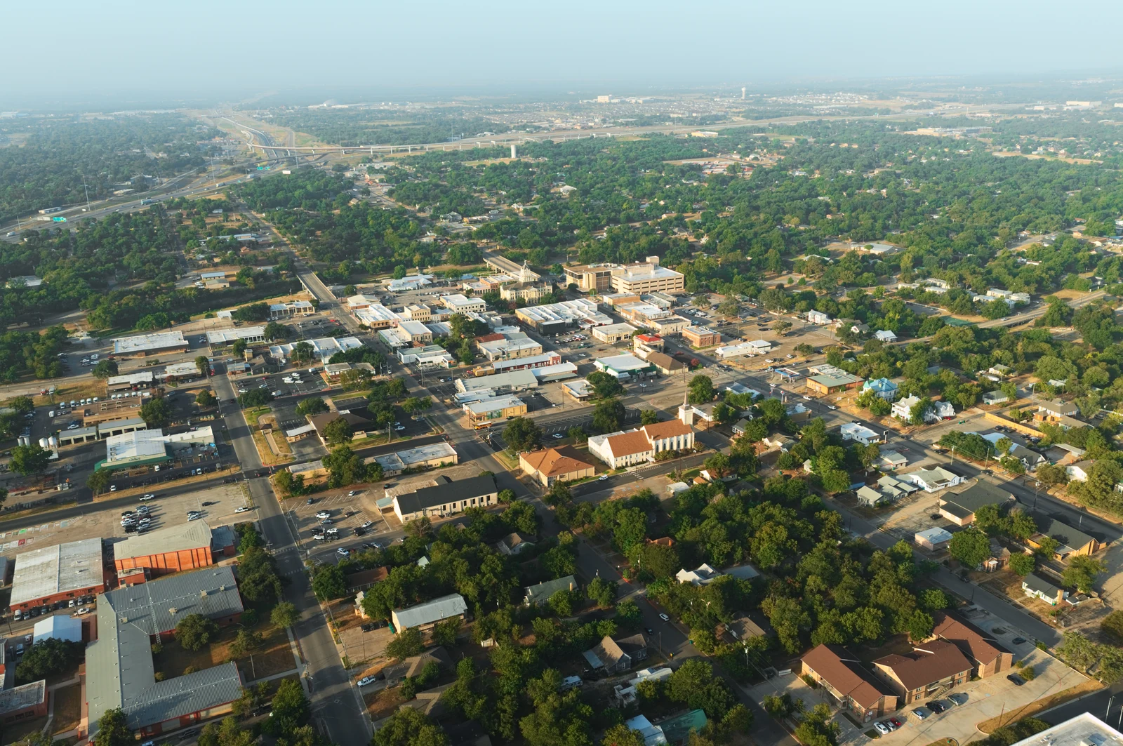 Morning aerial of downtown Belton, with the courthouse, churches, streets and surrounding neighborhoods.