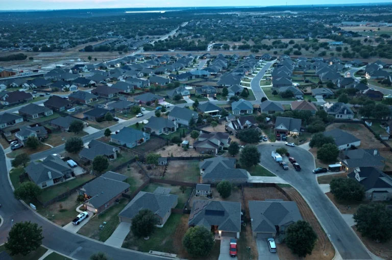 Aerial view of homes and streets in Hills of Westwood, with more of west Temple in the distance, Temple TX
