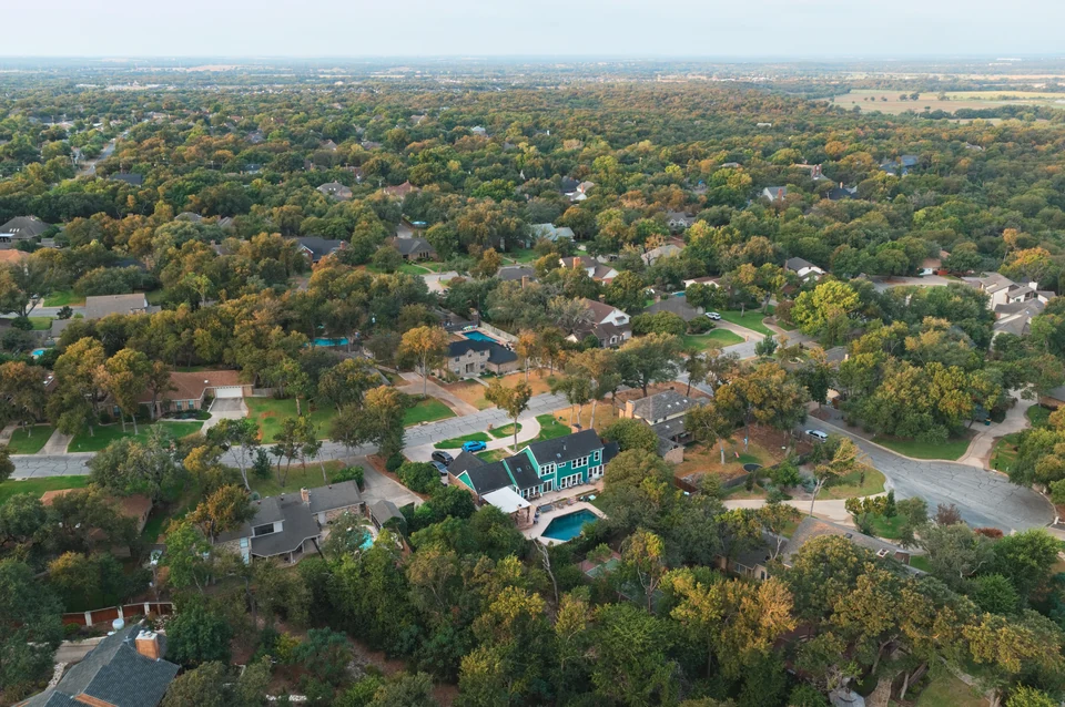 Aerial view of tree canopy, homes and residential streets in the Canyon Creek area, Temple TX
