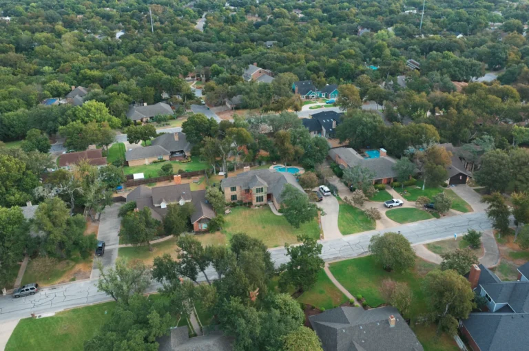 Aerial view of homes, front yards and a residential street in the Canyon Creek area of Temple, Texas.