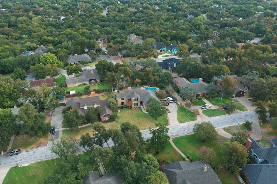Homes, front yards and a residential street in the Canyon Creek area of Temple, Texas, from the air