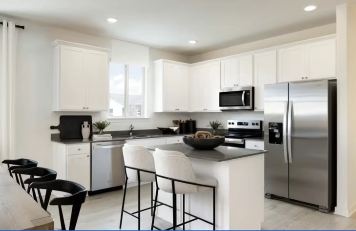 Staged Centex model kitchen with island and stainless appliances, from the County View gallery (Centex marketing photo)