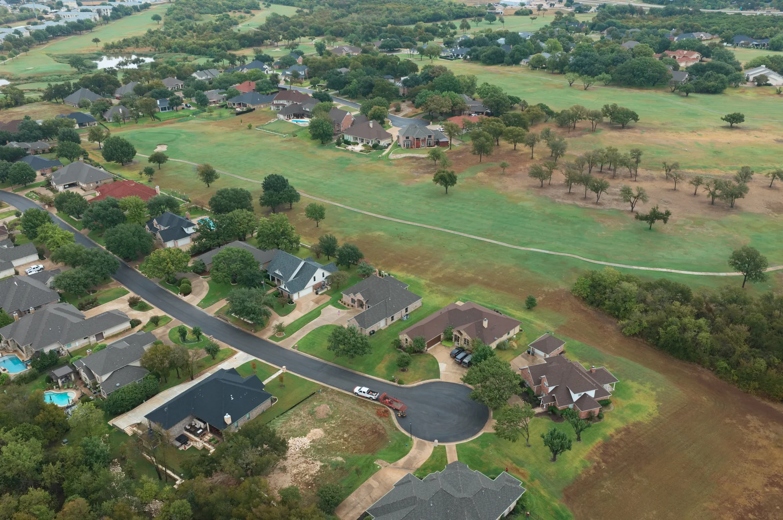 A cul-de-sac, homes and broad fairway in the Wildflower area.